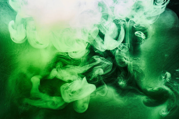 Abstract green color background. Swirling vibrant hookah smoke, underwater emerald ocean, dynamic paint in water - Фото, зображення