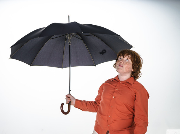 Freckled red-hair boy with umbrella. - Photo, image