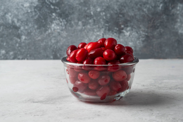 Cornel berries in a glass cup. High quality photo - Фото, зображення
