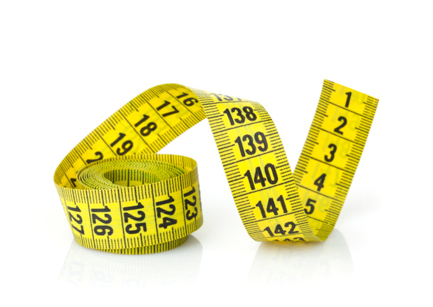 Proper nutrition for lose weight. Scale, measuring tape, apple on pink  background top view space for text Stock Photo