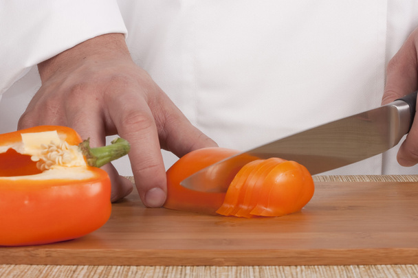 Chef Man cut vegetables on kitchen blackboard. - Fotografie, Obrázek
