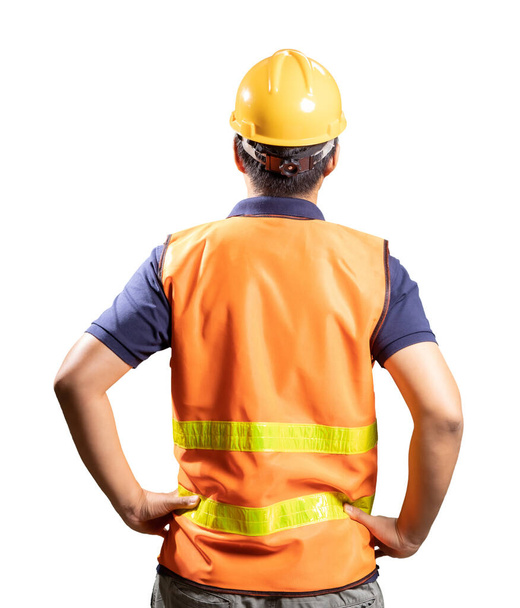 Ingeniero asiático o técnico usa casco de seguridad y chaleco reflectante vista trasera - Foto, imagen