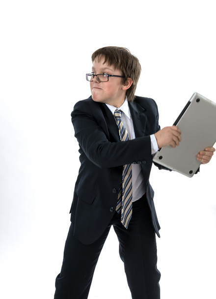 Elegant teenage boy throws laptop - Foto, afbeelding