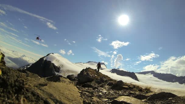 Helicopter and view of climber in  remote wilderness Mountain, Alaska, USA - Footage, Video