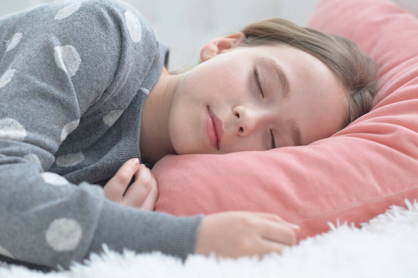  cute little girl sleeping in bed at home - Photo, Image