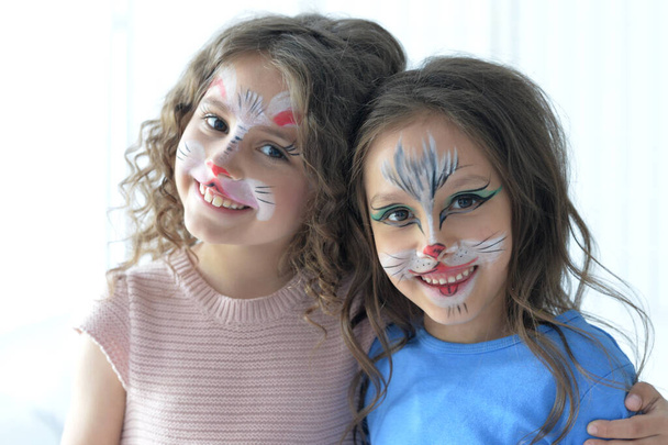 Cute little girls with faces painted  - Foto, Imagem