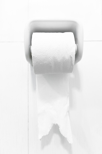 Cropped Shot Of Girl In White Underwear Holding Toilet Paper While