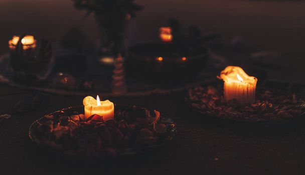 ceremonial candle on a bowl with rose lupines. - 写真・画像