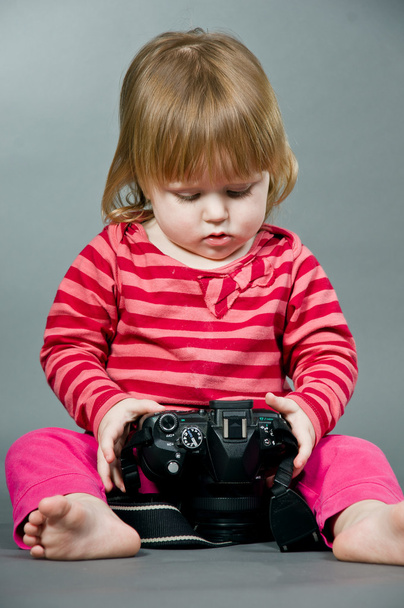 Cute little baby with digital photo camera - Photo, image