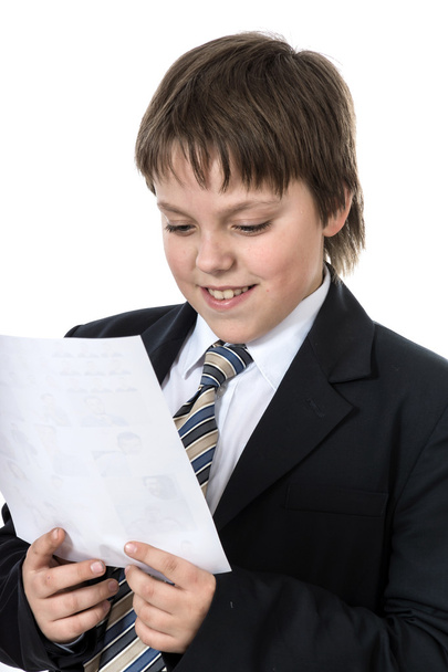 Teenage boy reading letter - 写真・画像