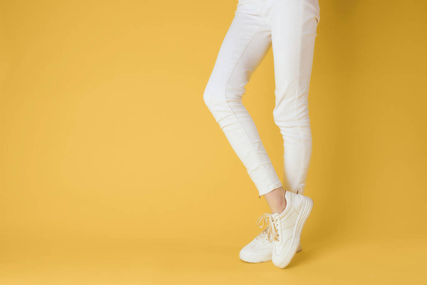 female feet white sneakers. High quality photo - Photo, Image