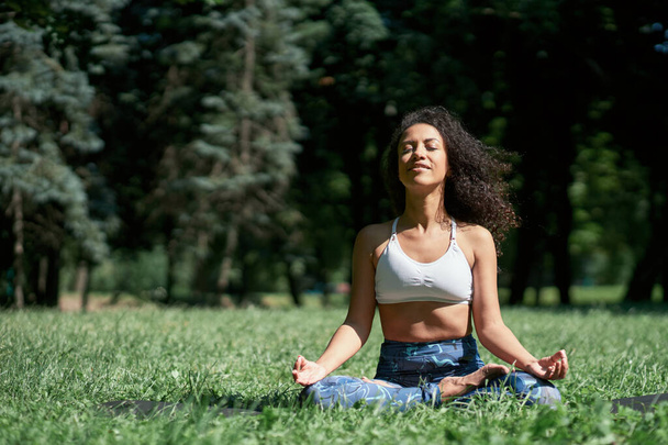 young woman meditates in the lotus position - Photo, Image