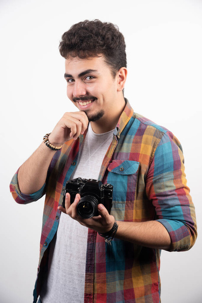 Photograph asking customer to smile as he is taking photos. High quality photo - Photo, Image