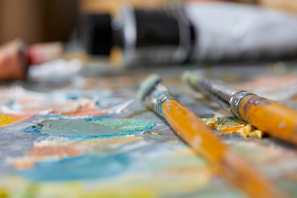 artist paint brushes on colorful background, closeup - Zdjęcie, obraz