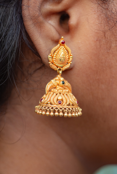 Gold Jimikki Kammal Earrings on Indian Girl Ears. Designed Earrings Stock Images. - Photo, Image