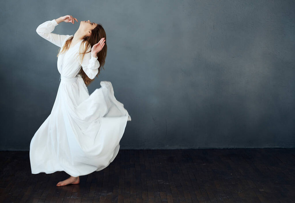 cheerful pretty woman in white dress elegant style dance performance - Fotografie, Obrázek