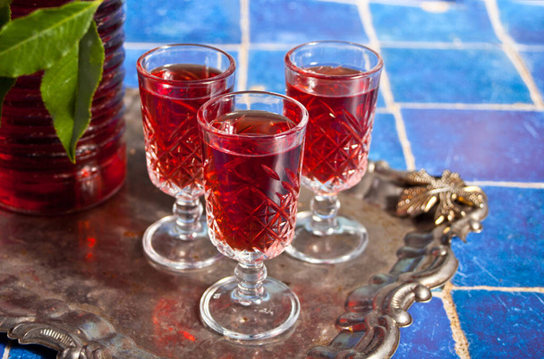 glasses of cherry brandy liqueur with ripe berries - Photo, Image