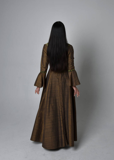 Full length  portrait of beautiful young asian woman with long hair wearing medieval fantasy gown costume. Graceful standing posing walking away,  isolated on studio background. - Foto, immagini