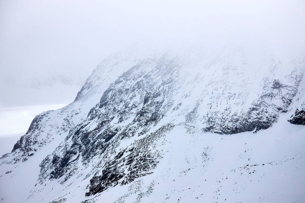 beautiful snowy and rocky mountain landscape - Fotó, kép