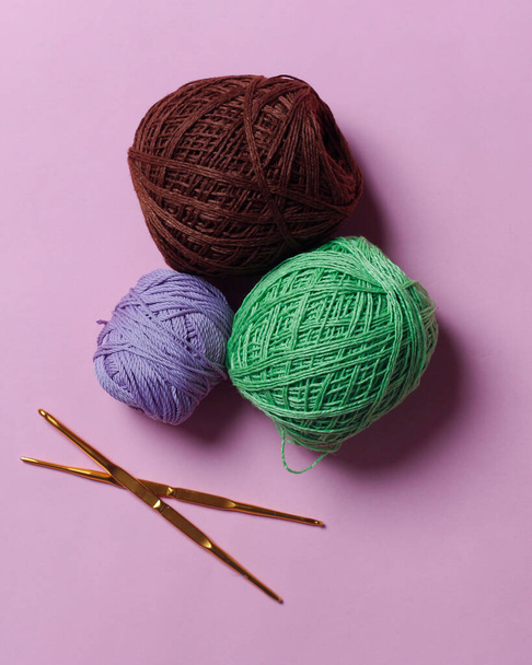 Wool thread isolated on bright background. Wool yarn is a yarn with a soft texture. Usually used for the main material for making knitting crafts such as clothes and hats. Focus blur. - 写真・画像