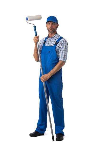 Male house painter man in uniform with paint roller Isolated over white background - Фото, зображення