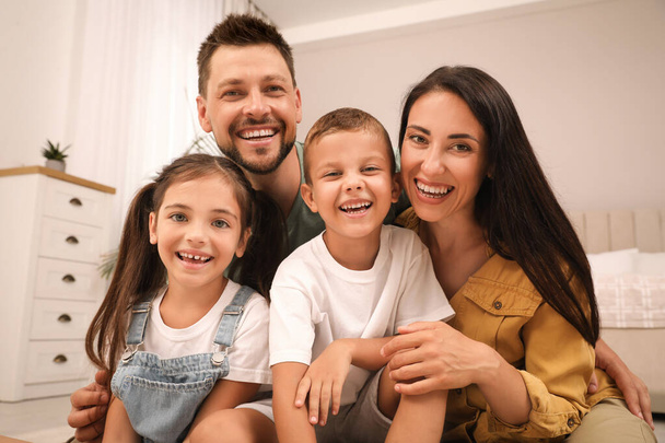 Portrait of happy family with children at home - Φωτογραφία, εικόνα