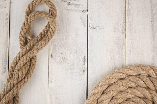 Image of old texture of white wooden boards with ship rope. - Photo, image