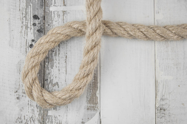 Image of old texture of white wooden boards with ship rope. - Photo, Image