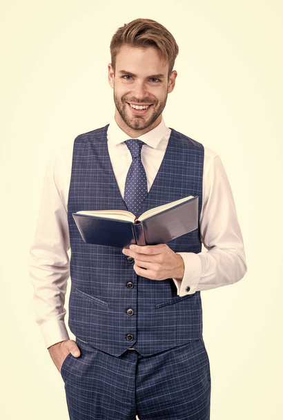 Happy schoolman smile holding open book in formal fashion style isolated on white, school - Photo, Image