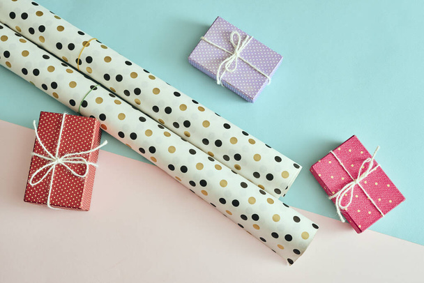 Different colored gift box on color background. - 写真・画像
