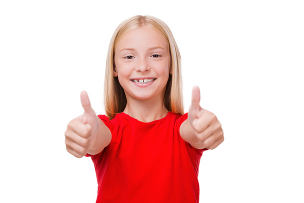 Little girl showing her thumbs up - Photo, image