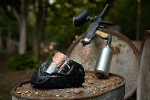 Paintball gun and protection mask closeup - Photo, Image
