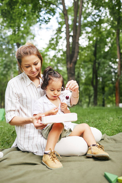 Young Mother Enjoying Day in Park - Photo, Image
