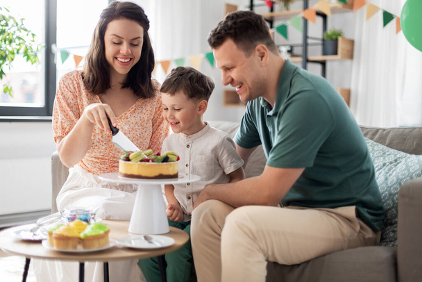 happy family with birthday cake at home - Zdjęcie, obraz