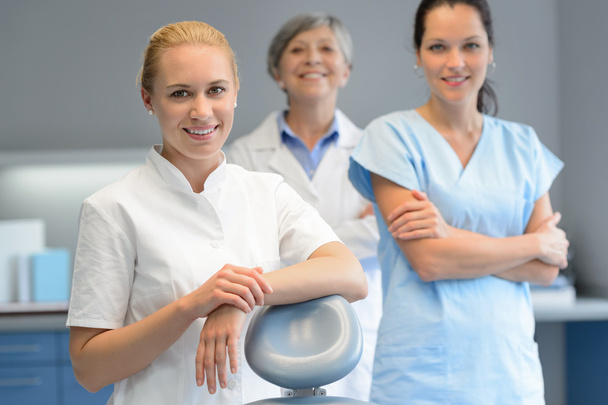 Three professional dentist woman at dental surgery - Foto, immagini