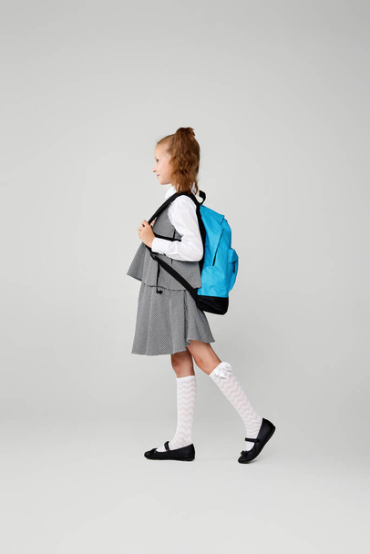 adorable schoolgirl with backpack. Back to school - Foto, imagen