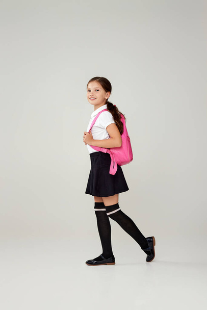 adorable schoolgirl with backpack. Back to school - Foto, Imagen