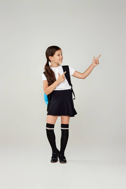 adorable schoolgirl with backpack. Back to school - Фото, изображение