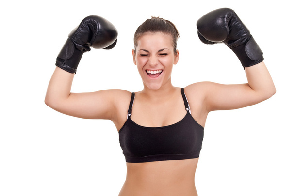 Happy young woman in boxing gloves, with her hands up-isolated on white - Foto, immagini