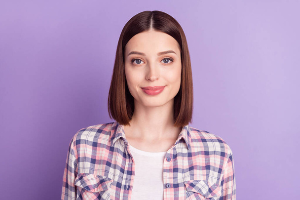 Portrait of attractive cheery content brown-haired girl wearing checked shirt isolated over purple violet color background - Fotó, kép