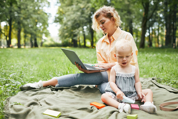 Mother Working Online in Park - Photo, Image