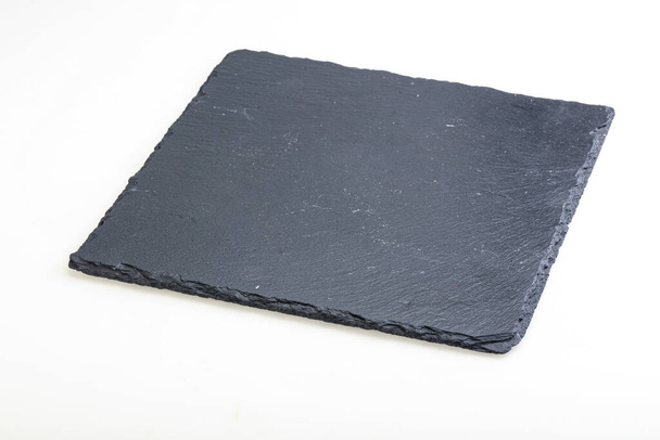 Bordo di pietra nero isolato su sfondo bianco - Foto, immagini