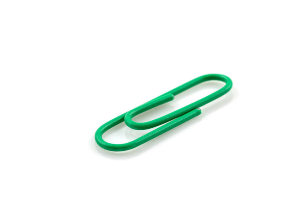 Single Green paper clip isolated on white background - Photo, Image