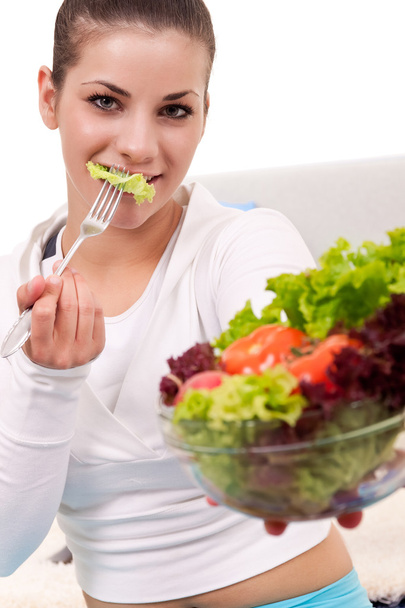 Donna che mangia insalata - Foto, immagini
