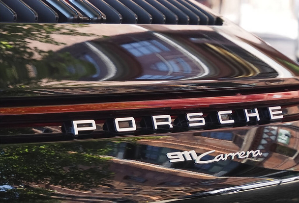 HAMBURG, GERMANY - Aug 01, 2021: A closeup of a black Porsche 911 Carrera car - Photo, image