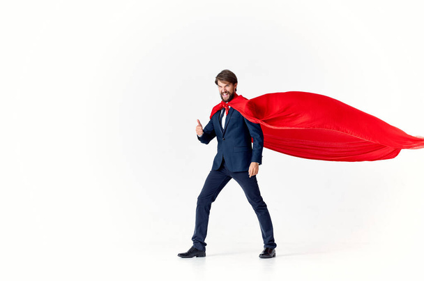 business man in red cloak protecting the city superhero work - Photo, Image