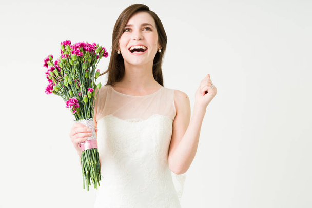 Yes, I'm so excited. Cheerful young bride screaming with happiness because she is marrying the love of her life - Foto, imagen