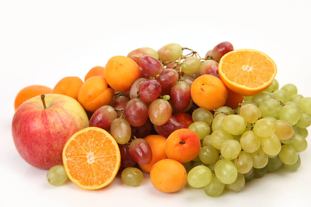 orange, grapes and other fruits on a white background  - Fotó, kép