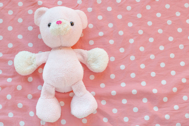 teddy bear with pink bow on a white background - Foto, afbeelding