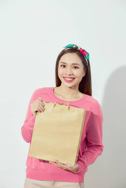 Charming beautiful tan skin Asian confident woman show shopping bags.  - Fotoğraf, Görsel